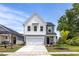 Charming two-story home with a two-car garage, landscaped yard, and a welcoming front porch at 82 Fairwinds Dr, Lillington, NC 27546