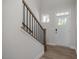 Entryway showcasing the staircase, hardwood floors, and a bright front door at 82 Fairwinds Dr, Lillington, NC 27546