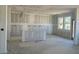 Unfinished kitchen area featuring multiple windows and an open layout at 82 Fairwinds Dr, Lillington, NC 27546