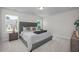 Spacious main bedroom featuring a large bed, windows, and soft carpeting at 82 Fairwinds Dr, Lillington, NC 27546