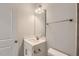 Stylish half bathroom featuring white vanity, brushed nickel fixtures, and tiled flooring at 936 Jasper Mine Trl # 885 Landrum, Raleigh, NC 27610