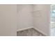 Walk-in closet featuring wire shelving and neutral carpeting at 936 Jasper Mine Trl, Raleigh, NC 27610