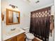 Bathroom featuring a shower/tub combo, toilet, and vanity with mirror and lighting at 100 Forsyth Dr, Chapel Hill, NC 27517