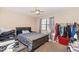 Bedroom featuring a bed, window with blinds, and clothing rack at 100 Forsyth Dr, Chapel Hill, NC 27517