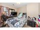 Bedroom featuring a bed with patterned bedding, window with blinds, and dressers at 100 Forsyth Dr, Chapel Hill, NC 27517