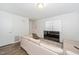 Inviting living room with wood flooring, a comfortable couch, and plenty of natural light, perfect for relaxation at 100 Forsyth Dr, Chapel Hill, NC 27517