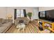 Cozy living room showcasing wood-look flooring, neutral walls, and a comfortable seating area at 100 Forsyth Dr, Chapel Hill, NC 27517