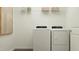 Functional laundry room with modern washer and dryer units, and practical storage solutions at 10064 Regal Dr, Angier, NC 27501