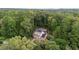 Estate home with solar panels, a private pool, and lush greenery at 1017 Holly Creek Ln, Chapel Hill, NC 27516
