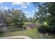 Expansive backyard featuring pond, garden, mature trees, and lush greenery on a sprawling lot at 1017 Holly Creek Ln, Chapel Hill, NC 27516