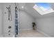 Bright bathroom features a shower with a skylight and tile flooring at 1017 Holly Creek Ln, Chapel Hill, NC 27516