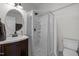 Bathroom showcasing a corner shower with glass doors, vanity with a sink and toilet at 1017 Holly Creek Ln, Chapel Hill, NC 27516