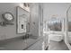 Bright and airy bathroom with double vanity, a soaking tub, and a separate glass shower at 1017 Holly Creek Ln, Chapel Hill, NC 27516