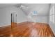 A well-lit bedroom features hardwood floors, plantation shutters, and a skylight at 1017 Holly Creek Ln, Chapel Hill, NC 27516