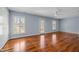Large primary bedroom features wood flooring, shuttered windows and ample natural light at 1017 Holly Creek Ln, Chapel Hill, NC 27516