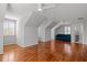 Bright bonus room features hardwood floors, three ceiling fans, and a large window at 1017 Holly Creek Ln, Chapel Hill, NC 27516