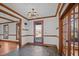 View of the foyer with slate flooring and wood trim, leading to other rooms in the home at 1017 Holly Creek Ln, Chapel Hill, NC 27516