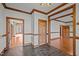 Foyer with slate flooring and wood trim, flowing into bright rooms with hardwood floors at 1017 Holly Creek Ln, Chapel Hill, NC 27516