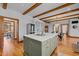 Spacious kitchen island area with hardwood floors and storage at 1017 Holly Creek Ln, Chapel Hill, NC 27516