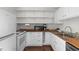 Kitchen featuring white cabinetry, butcher block countertops, modern appliances and a vintage stove at 1017 Holly Creek Ln, Chapel Hill, NC 27516