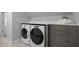 Convenient laundry area with modern washer and dryer, plenty of counter space, and storage at 1017 Holly Creek Ln, Chapel Hill, NC 27516