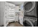 Bright laundry room featuring a Miele fridge and a GE washer and dryer at 1017 Holly Creek Ln, Chapel Hill, NC 27516