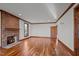 Expansive living room featuring hardwood floors, brick fireplace, and neutral walls perfect for relaxation and entertaining at 1017 Holly Creek Ln, Chapel Hill, NC 27516