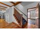 Elegant staircase showcases wood accents and a stylish runner, enhancing the home's architectural charm and appeal at 1017 Holly Creek Ln, Chapel Hill, NC 27516