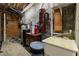 Basement utility area featuring a laundry sink, water filtration equipment and storage space at 1017 Holly Creek Ln, Chapel Hill, NC 27516