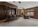 This basement bar includes wood finishes, granite countertop, barstool seating, a stone fireplace, and a game table at 102 Anna Lake Ln, Cary, NC 27513
