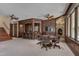 Basement bar offers elegant wood finishes, granite counters, barstool seating, stone fireplace and a game table at 102 Anna Lake Ln, Cary, NC 27513