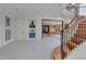 Finished basement with staircase, recreation room, and movie posters at 102 Anna Lake Ln, Cary, NC 27513