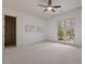 Spacious bedroom with lake views, art, and access to a balcony at 102 Anna Lake Ln, Cary, NC 27513