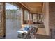 Dock with stone arches, wood ceilings, and views of the lake with a paddle boat at 102 Anna Lake Ln, Cary, NC 27513