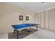 Bright and airy game room with a ping pong table, perfect for recreation and entertainment at 102 Anna Lake Ln, Cary, NC 27513