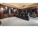 Home theater featuring leather seating and a projector system for an immersive viewing experience at 102 Anna Lake Ln, Cary, NC 27513