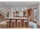 Spacious kitchen with a large island and modern lighting at 102 Anna Lake Ln, Cary, NC 27513