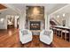 Open concept living space with stone fireplace and modern furnishings at 102 Anna Lake Ln, Cary, NC 27513