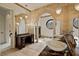 Bright main bathroom with double sinks, soaking tub, and elegant stone accents at 102 Anna Lake Ln, Cary, NC 27513