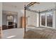 Primary bedroom with a four poster bed, fireplace, and a door leading to a balcony at 102 Anna Lake Ln, Cary, NC 27513