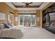 Spacious main bedroom with lake views, fireplace, and private access to outdoor seating at 102 Anna Lake Ln, Cary, NC 27513