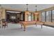 Recreation room with pool table, wet bar, and beautiful lake views at 102 Anna Lake Ln, Cary, NC 27513