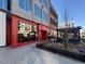 Restaurant exterior with red accents and outdoor seating at 102 Anna Lake Ln, Cary, NC 27513