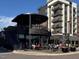 Exterior view of a two-story restaurant in a busy plaza with outdoor seating at 102 Anna Lake Ln, Cary, NC 27513