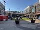 Town square with people enjoying the day and shops in the background at 102 Anna Lake Ln, Cary, NC 27513