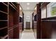 Organized walk-in closet with custom shelving and ample storage space at 102 Anna Lake Ln, Cary, NC 27513