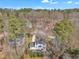 Aerial view of a home nestled among trees with a spacious yard and inviting deck at 106 Ferris Wheel Ct, Cary, NC 27513