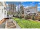 Spacious backyard featuring lush green lawn and a wood-framed garden at 106 Ferris Wheel Ct, Cary, NC 27513
