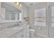Bright bathroom features marble countertop, subway tiles, and a glass-enclosed shower at 106 Ferris Wheel Ct, Cary, NC 27513