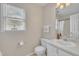 Bathroom with white vanity and neutral walls, with window for natural light at 106 Ferris Wheel Ct, Cary, NC 27513